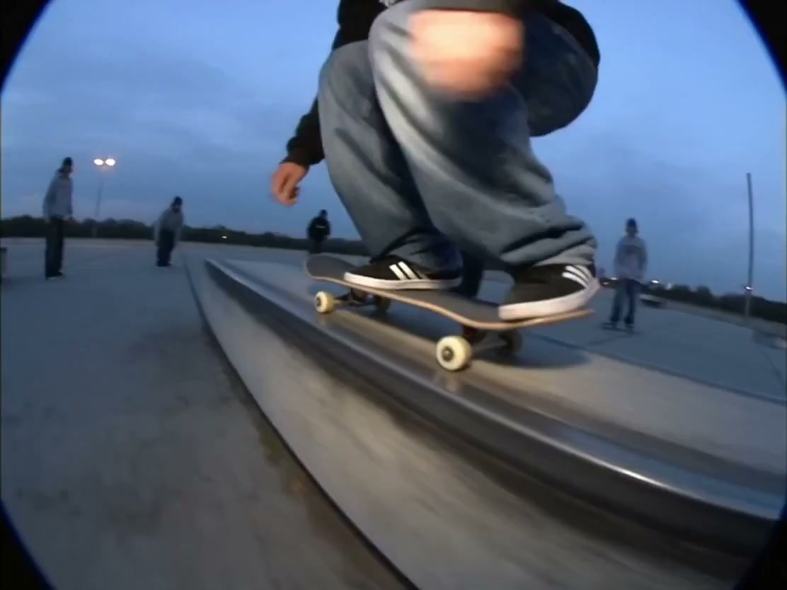 Aura Magazine brand film still, skateboard grinding a ledge at dusk